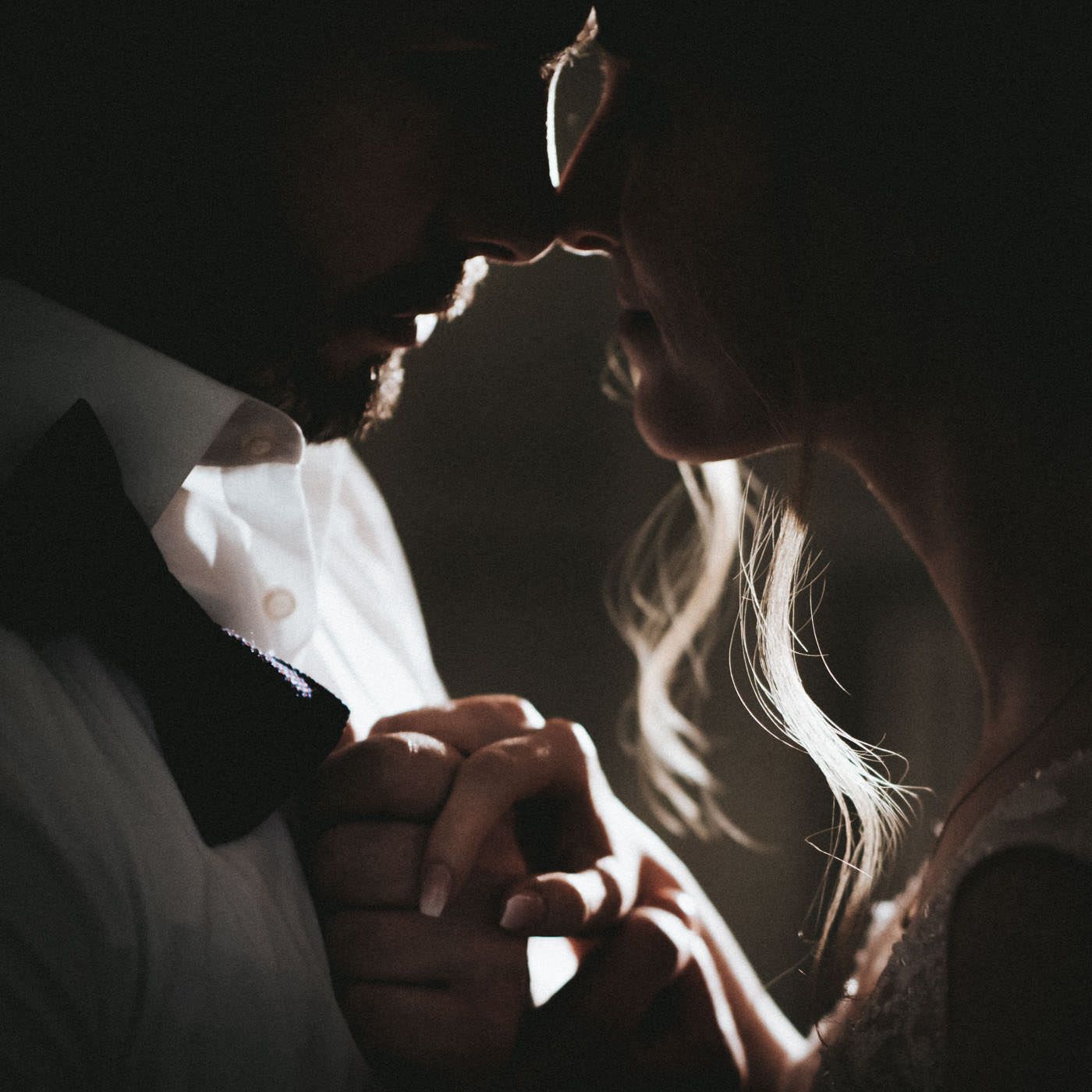 Intimate Portrait of bridal couple with back light from an iphone