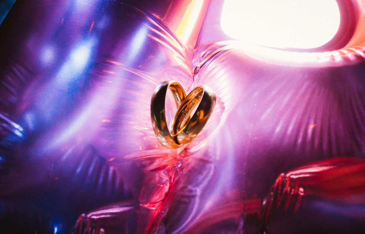 Colourful ring shots - wedding rings on colourful balloons during a wedding at Hornbach Monastery