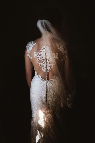 Bride from behind - fantastic wedding dress with lace back neckline