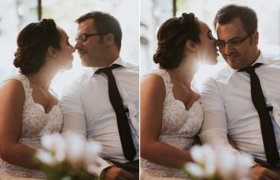 Bridal couple kissing and cuddling in wedding photos in the foyer of Hotel Kloster Hornbach